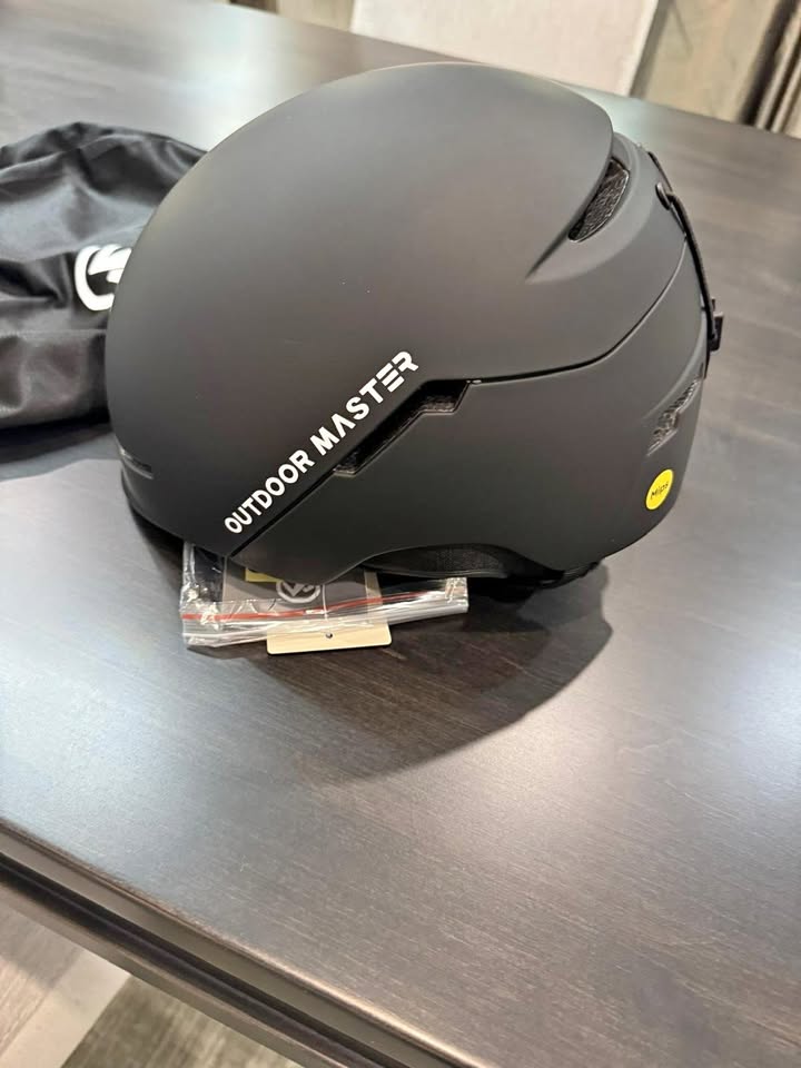 black helmet on wooden surface