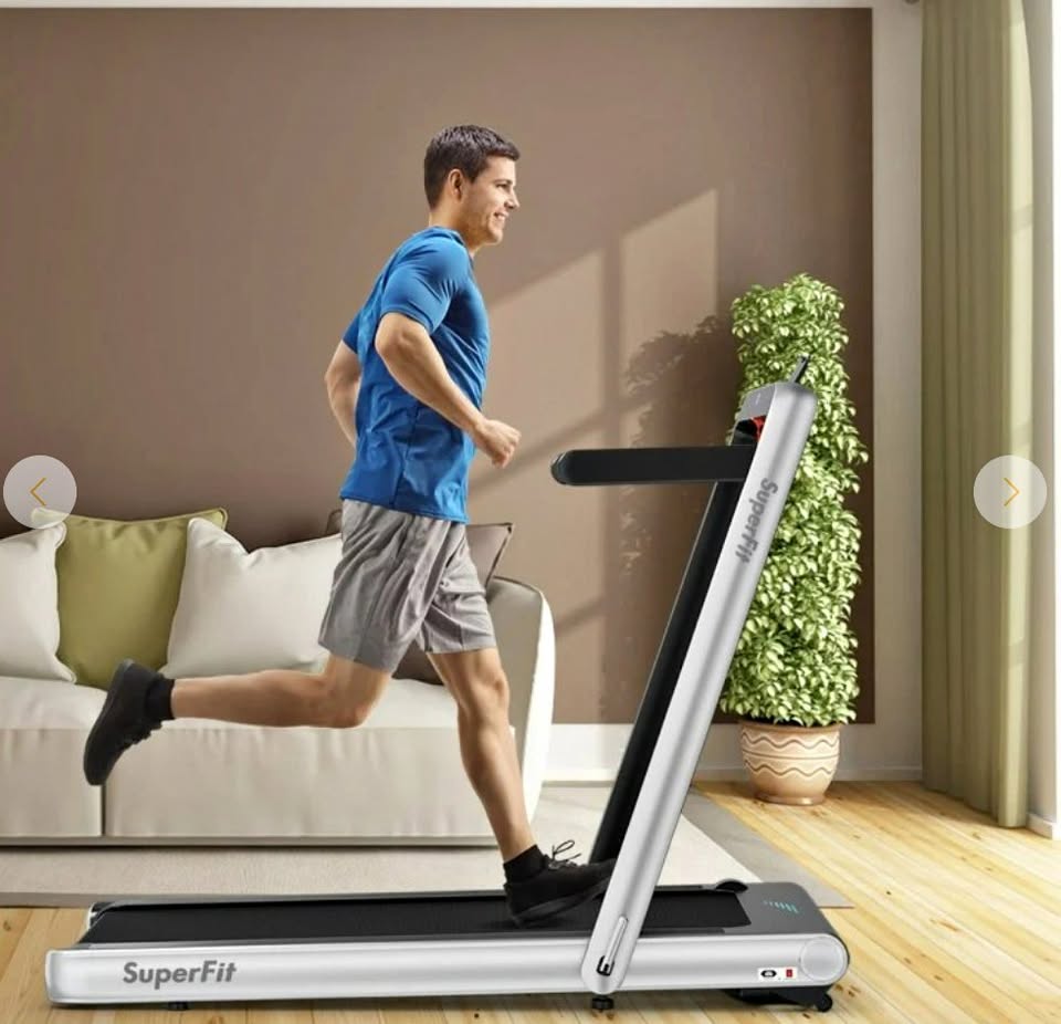 Man running on treadmill at home