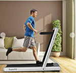 Man running on treadmill at home