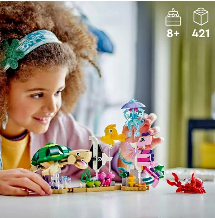 Child is playing with LEGO creator ocean themed building toys