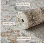 Rolled-up rug with text labels on a textured surface