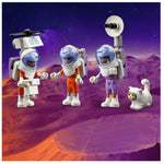 Toy figures of astronauts and a cat on a space-themed