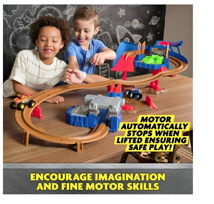 Two kids playing with racing trek with truck set