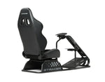 Black racing simulator seat with steering wheel base