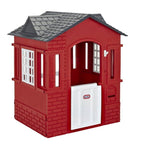 Red playhouse with a gray roof on a white background