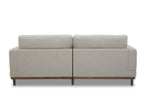Beige sectional sofa with wooden legs.