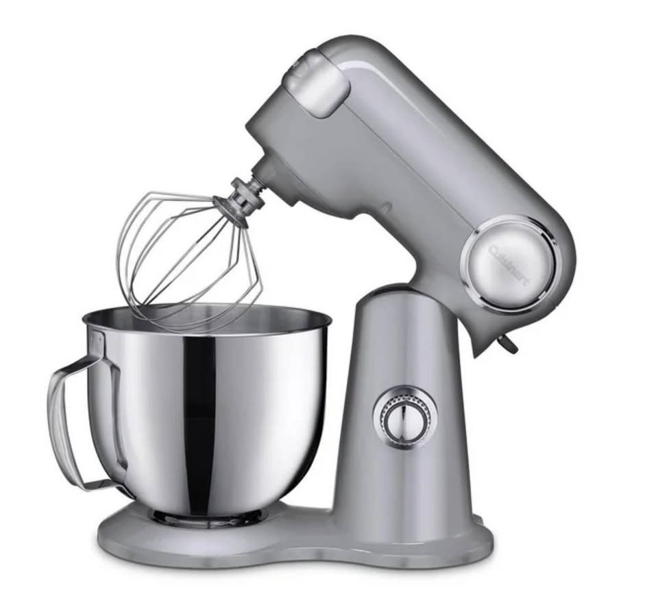 Silver stand mixer with a metal bowl and a whisk attachment