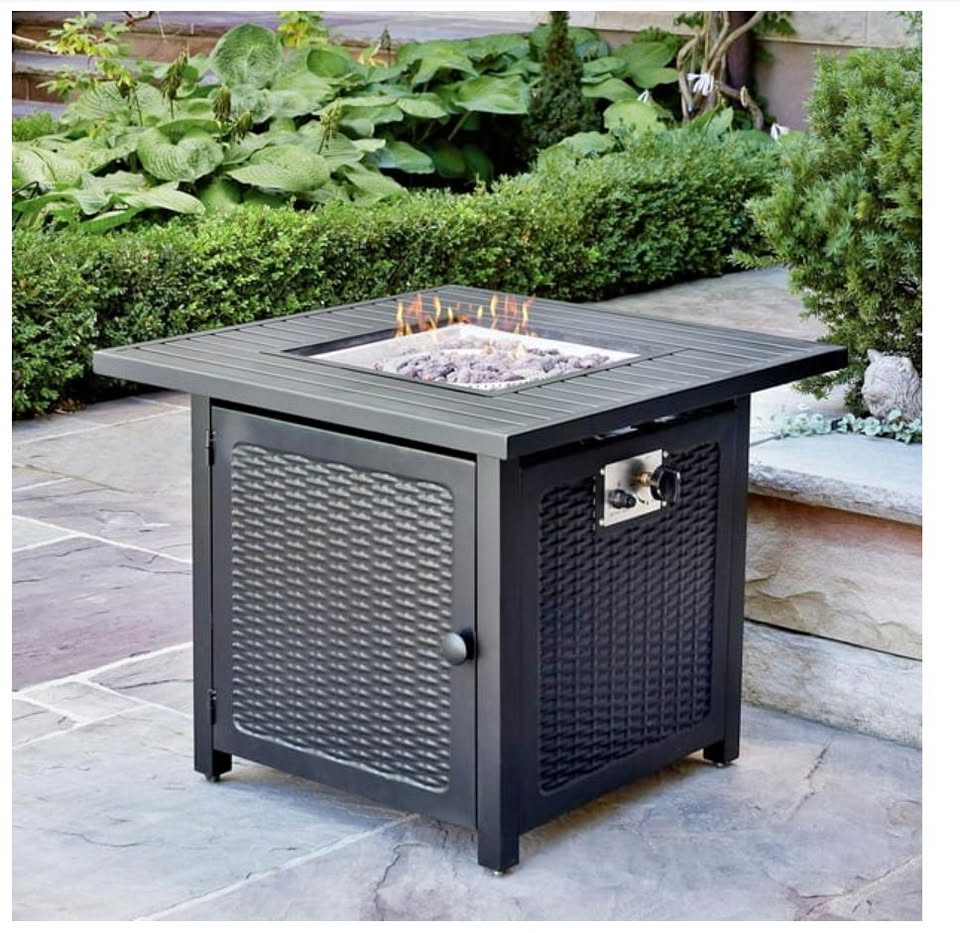 Outdoor fire pit table with flames