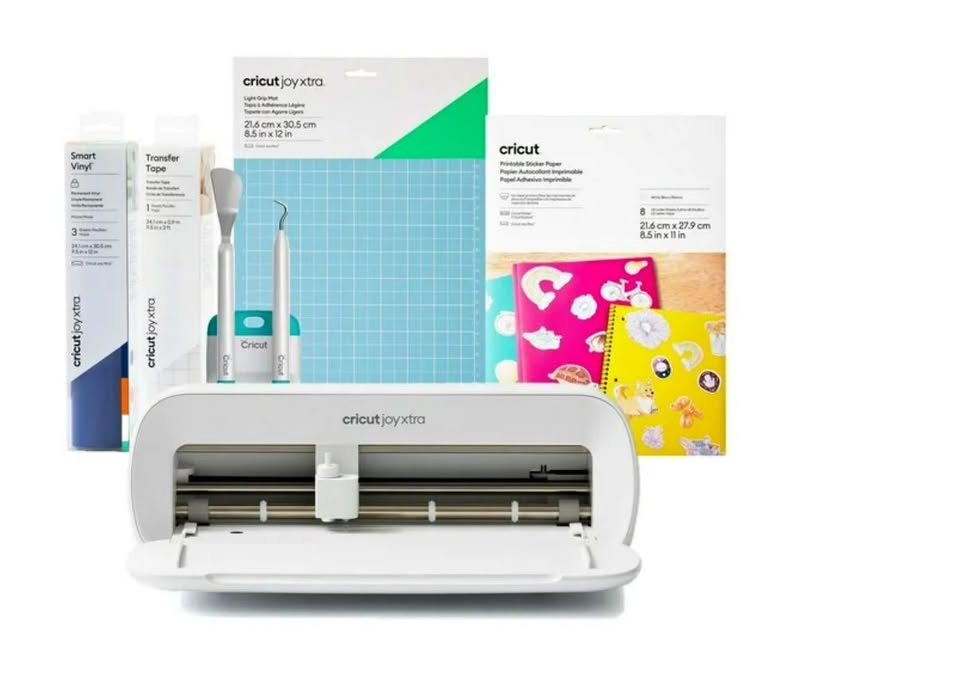 Cricut cutting machine with supplies on a white background
