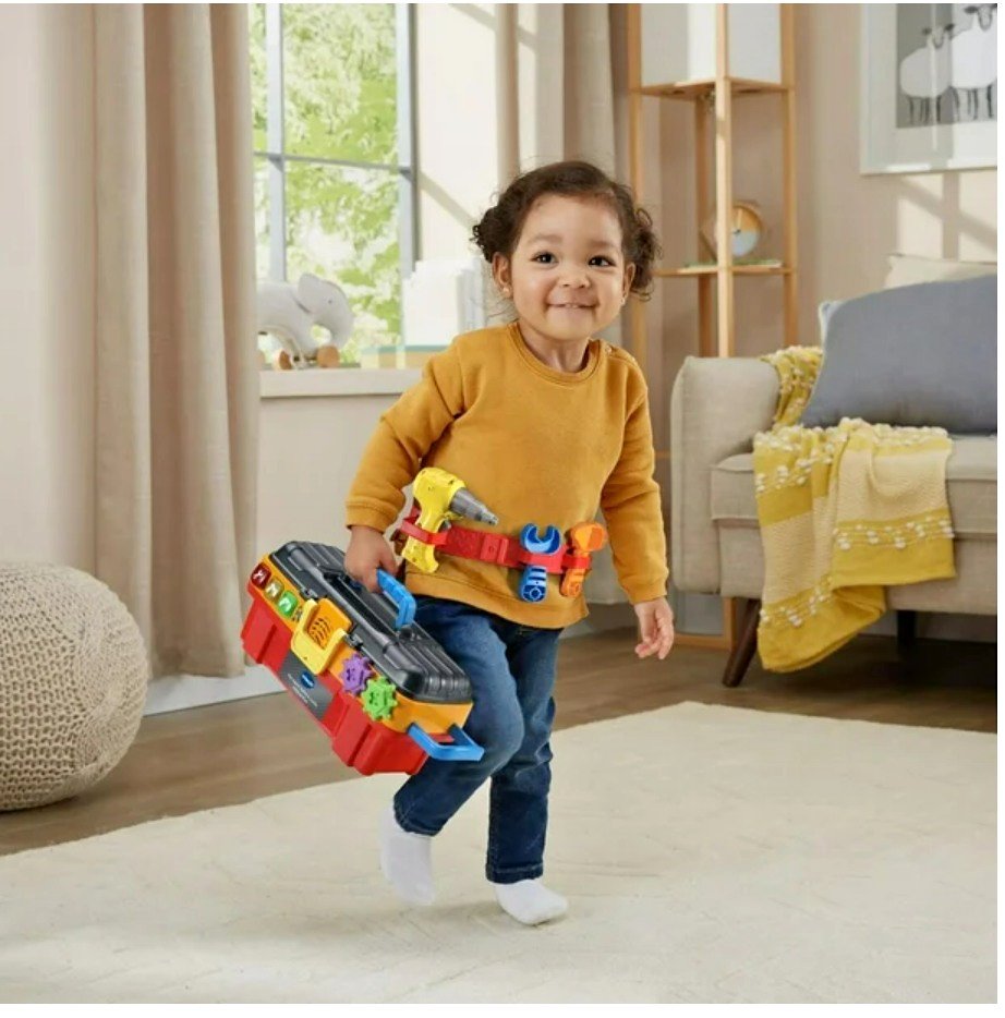 Child holding tool set box