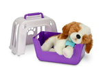 Plush dog toy in a purple pet carrier 