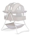 White baby bassinet with mesh hood on a white background