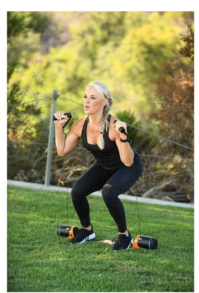 Woman exercising outdoors with resistance bands