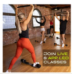 Group of people exercising in a studio with text promoting live and app-led classes.