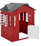Red playhouse with an open door.