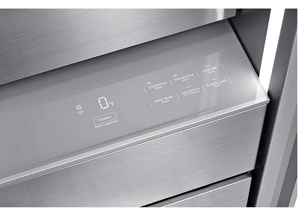 Stainless steel refrigerator door with control panel and icons