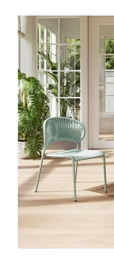 Light green chair in a room.