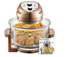 Hot air fryer with food items inside and a recipe book