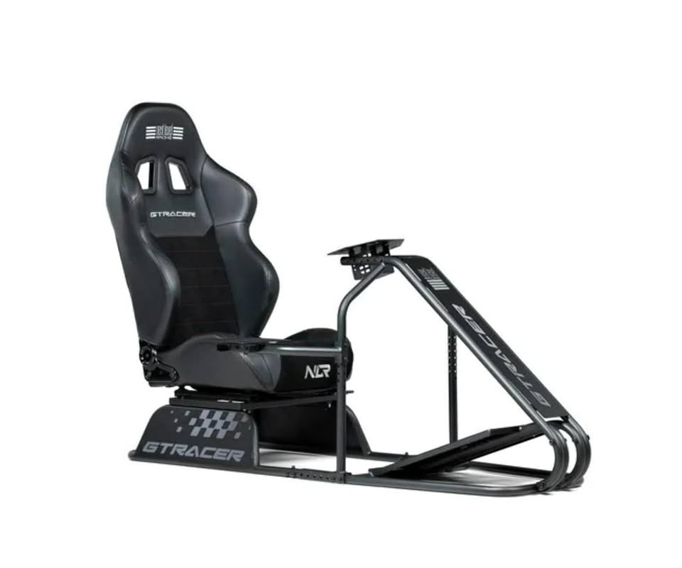 Black gaming chair with steering wheel and pedals