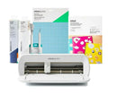 Cricut cutting machine with supplies on a white background